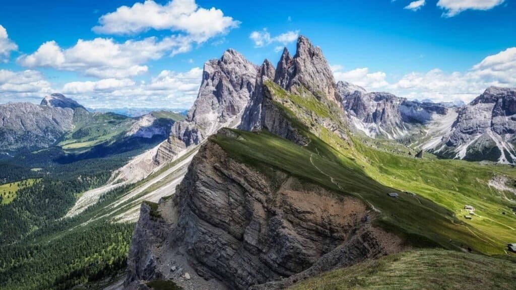 The Seceda ridge in South Tyrol, with the limestone towers of the Dolomites behind