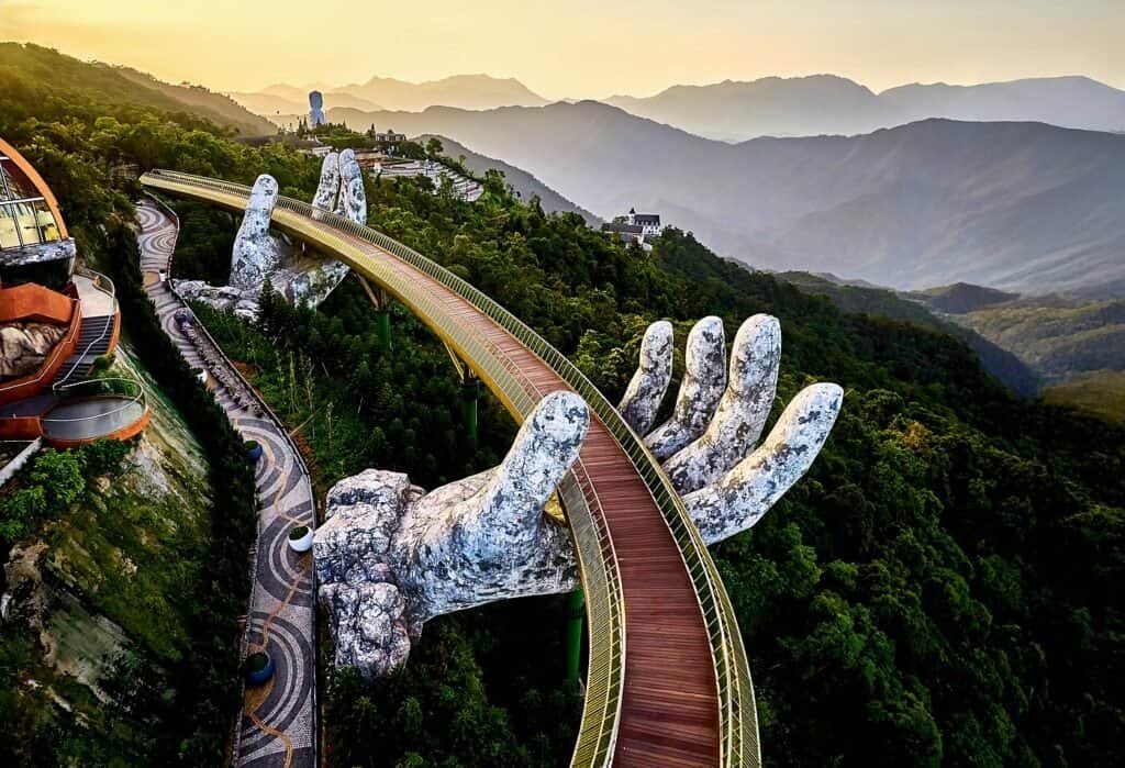 The Golden Bridge held up by two giant stone hands at Ba Na Hills near Da Nang, Vietnam