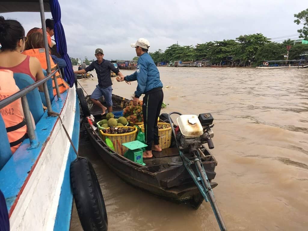 Boats trading produce at the Cai Rang floating market in the Mekong Delta, Vietnam